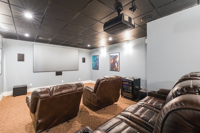Home cinema with big brown leather chairs